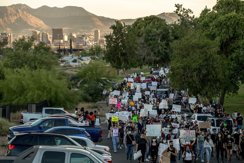 Demonstrators march down Copper Avenue toward the El Paso Police Department headquarters building during a protest over the death of George Floyd on May 31, 2020.